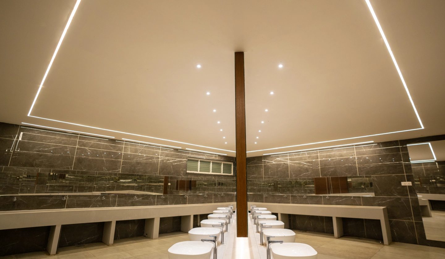 Covered dining pavilion beside Pearl Lawn with timber columns and banquet tables laid