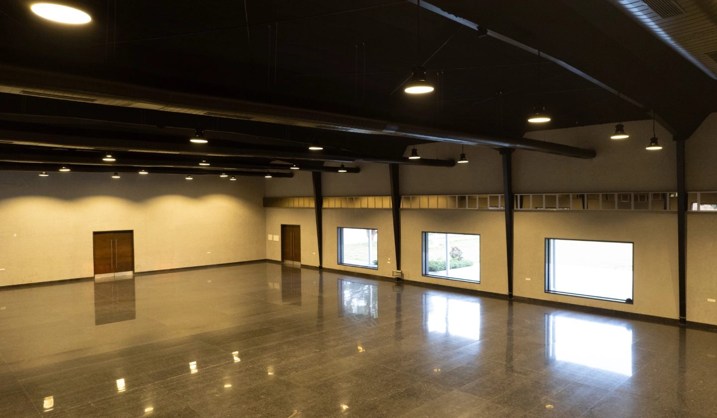 Ruby hall empty with warm daylight coming through the window bays