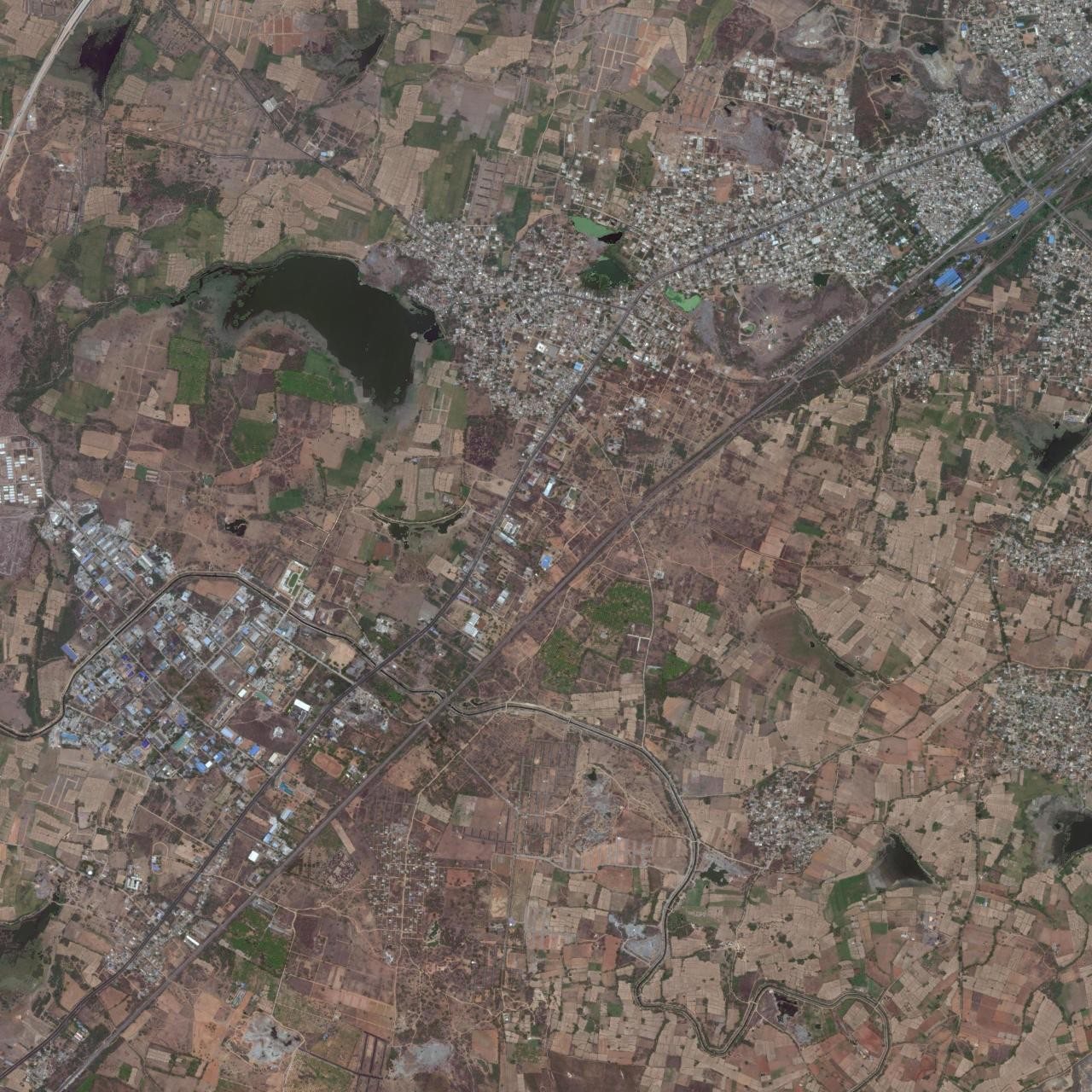 Satellite view of the wider Madikonda and Kazipet area, with the highway and the rail line crossing it.